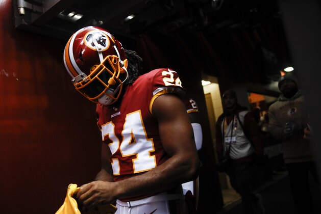 Washington Redskins cornerback Josh Norman (24) walk onto the field before the first half of an NFL football game between the Washington Redskins and the New York Jets Sunday, Nov. 17, 2019, in Landover, Md. (AP Photo/Patrick Semansky)
