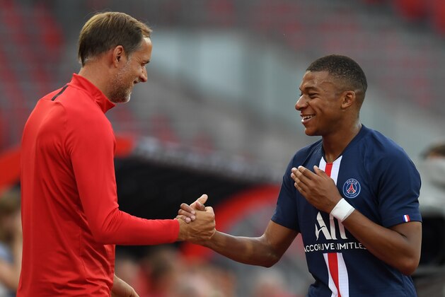 Paris Saint-Germain's German head coach Thomas Tuchel reacts with midfielder Kylian Mbappe (R) during the pre-season friendly football match Nuremberg v Paris Saint-Germain (PSG) on July 20, 2019 in Nuremberg. (Photo by Christof STACHE / AFP)        (Photo credit should read CHRISTOF STACHE/AFP via Getty Images)