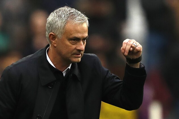 Tottenham Hotspur's Portuguese head coach Jose Mourinho reacts after Tottenham Hotspur's English striker Harry Kane scores his team's third goal during the English Premier League football match between West Ham United and Tottenham Hotspur at The London Stadium, in east London on November 23, 2019. (Photo by Adrian DENNIS / AFP) / RESTRICTED TO EDITORIAL USE. No use with unauthorized audio, video, data, fixture lists, club/league logos or 'live' services. Online in-match use limited to 120 images. An additional 40 images may be used in extra time. No video emulation. Social media in-match use limited to 120 images. An additional 40 images may be used in extra time. No use in betting publications, games or single club/league/player publications. /  (Photo by ADRIAN DENNIS/AFP via Getty Images)