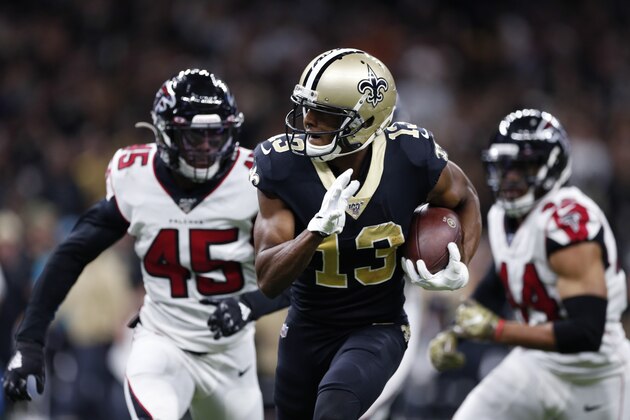 New Orleans Saints wide receiver Michael Thomas (13) carries on a pass reception ahead of Atlanta Falcons linebacker Deion Jones (45) and defensive end Vic Beasley (44) in the first half of an NFL football game in New Orleans, Sunday, Nov. 10, 2019. (AP Photo/Rusty Costanza)