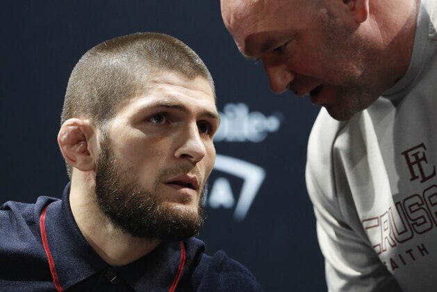 Khabib Nurmagomedov, left, listens to Dana White during a news conference for the UFC 229 mixed martial arts bouts Thursday, Oct. 4, 2018, in Las Vegas. Nurmagomedov is scheduled to fight Conor McGregor on Saturday in Las Vegas. (AP Photo/John Locher)
