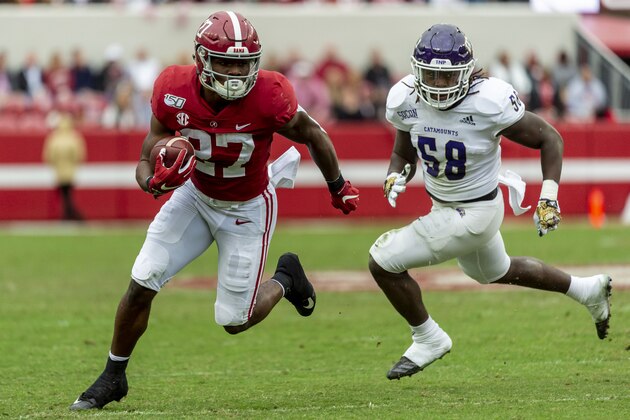 Alabama running back Jerome Ford (27) runs ahead of Western Carolina linebacker Darrius Smith (58) during the second half of an NCAA college football game, Saturday, Nov. 23, 2019, in Tuscaloosa, Ala. (AP Photo/Vasha Hunt)