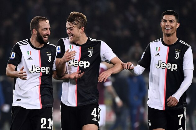 Juventus' defender Matthijs de Ligt from Netherland (C) celebrates with Juventus' Portuguese forward Cristiano Ronaldo (R) and Juventus' forward Gonzalo Higuain from Argentina  (L) at the end of the Italian Serie A football match Torino vs Juventus on November 2, 2019 at the 'Stadio Olimpico Grande Torino' in Turin. (Photo by MARCO BERTORELLO / AFP) (Photo by MARCO BERTORELLO/AFP via Getty Images)