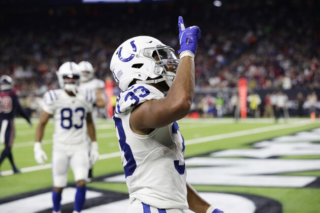 Indianapolis Colts running back Jonathan Williams (33) celebrates as he scores a touchdown against the Houston Texans during the second half of an NFL football game Thursday, Nov. 21, 2019, in Houston. (AP Photo/Mike Marshall)