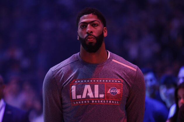 Los Angeles Lakers' Anthony Davis listens to the national anthem before an NBA basketball game against the Miami Heat Friday, Nov. 8, 2019, in Los Angeles. (AP Photo/Marcio Jose Sanchez)