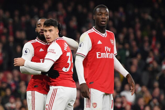 LONDON, ENGLAND - NOVEMBER 23: Alexandre Lacazette of Arsenal  celebrates after scoring his team's second goal during the Premier League match between Arsenal FC and Southampton FC at Emirates Stadium on November 23, 2019 in London, United Kingdom. (Photo by Shaun Botterill/Getty Images)