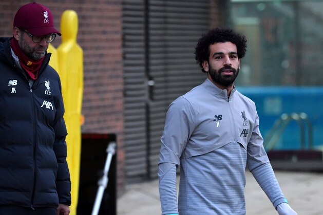 Liverpool's German manager Jurgen Klopp (L) and Liverpool's Egyptian midfielder Mohamed Salah attends a team training session at Melwood in Liverpool, north west England on November 4, 2019, on the eve of their UEFA Champions League Group E football match against Genk. (Photo by Paul ELLIS / AFP) (Photo by PAUL ELLIS/AFP via Getty Images)