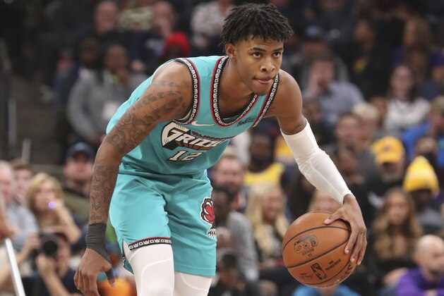 Memphis Grizzlies Ja Morant (12) looks to pass in the second half of a NBA basketball game against Los Angeles Lakers Saturday, Nov. 23, 2019, in Memphis, Tenn. (AP Photo/Karen Pulfer Focht)