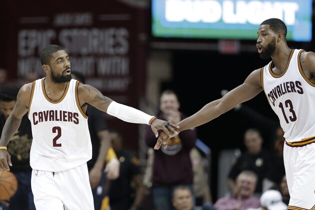 Cleveland Cavaliers' Kyrie Irving (2) and Tristan Thompson (13) celebrate in the second half of an NBA basketball game against the Denver Nuggets, Saturday, Feb. 11, 2017, in Cleveland. (AP Photo/Tony Dejak)