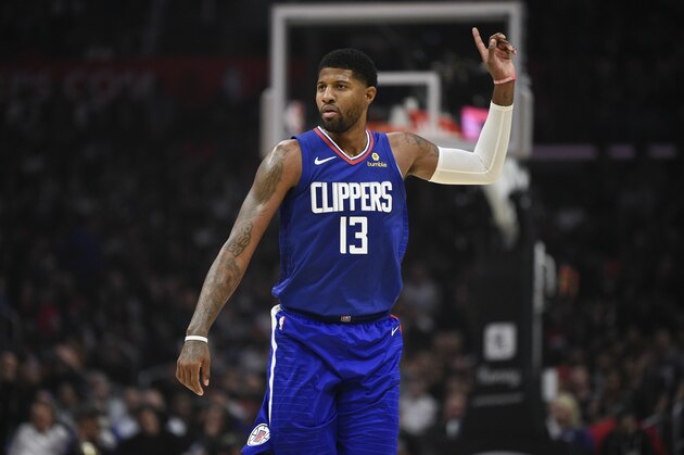 Los Angeles Clippers forward Paul George points back during the first half of an NBA basketball game against the New Orleans Pelicans in Los Angeles, Sunday, Nov. 24, 2019. (AP Photo/Kelvin Kuo)