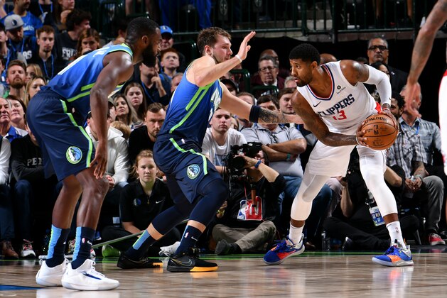 DALLAS, TX - NOVEMBER 26: Paul George #13 of the LA Clippers handles the ball against the Dallas Mavericks on November 26, 2019 at the American Airlines Center in Dallas, Texas. NOTE TO USER: User expressly acknowledges and agrees that, by downloading and or using this photograph, User is consenting to the terms and conditions of the Getty Images License Agreement. Mandatory Copyright Notice: Copyright 2019 NBAE (Photo by Glenn James/NBAE via Getty Images)