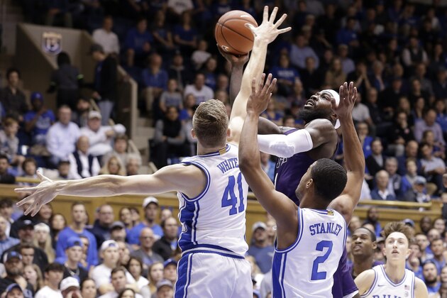 Stephen F. Austin guard Kevon Harris drives to the basket against Duke forward Jack White (41) and guard Cassius Stanley (2) during the first half of an NCAA college basketball game in Durham, N.C., Tuesday, Nov. 26, 2019. (AP Photo/Gerry Broome)