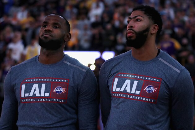 PHOENIX, ARIZONA - NOVEMBER 12: LeBron James #23 and Anthony Davis #3 of the Los Angeles Lakers stand attended for the national anthem before the NBA game against the Phoenix Suns at Talking Stick Resort Arena on November 12, 2019 in Phoenix, Arizona.  NOTE TO USER: User expressly acknowledges and agrees that, by downloading and/or using this photograph, user is consenting to the terms and conditions of the Getty Images License Agreement  (Photo by Christian Petersen/Getty Images)