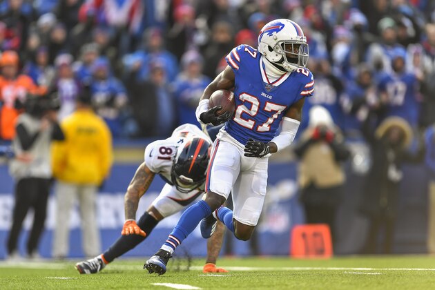 Buffalo Bills cornerback Tre'Davious White (27) avoids Denver Broncos wide receiver Tim Patrick (81) after intercepting a pass during the second quarter of an NFL football game, Sunday, Nov. 24, 2019, in Orchard Park, N.Y. (AP Photo/Adrian Kraus)