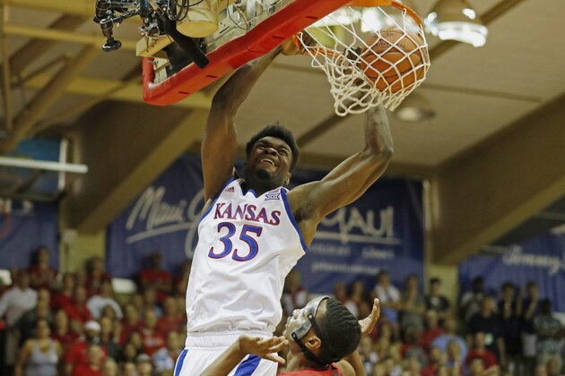 Kansas center Udoka Azubuike (35) dunks the ball over Dayton guard Rodney Chatman (0) during the first half of an NCAA college basketball game Wednesday, Nov. 27, 2019, in Lahaina, Hawaii. (AP Photo/Marco Garcia)