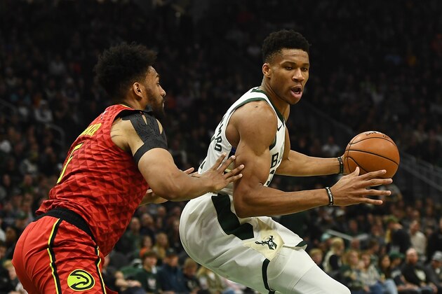 MILWAUKEE, WISCONSIN - NOVEMBER 27:  Giannis Antetokounmpo #34 of the Milwaukee Bucks is defended by Jabari Parker #5 of the Atlanta Hawks during the first half of a game at Fiserv Forum on November 27, 2019 in Milwaukee, Wisconsin. NOTE TO USER: User expressly acknowledges and agrees that, by downloading and or using this photograph, User is consenting to the terms and conditions of the Getty Images License Agreement. (Photo by Stacy Revere/Getty Images)
