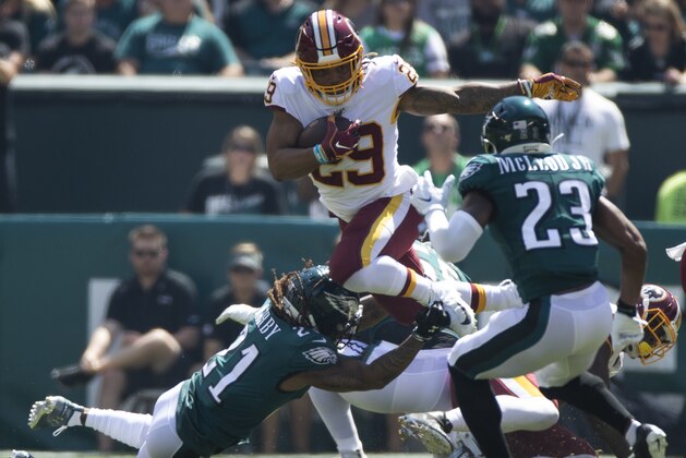 Washington Redskins running back Derrius Guice (29) jumps over Philadelphia Eagles cornerback Ronald Darby while carrying the football during an NFL football game, Sunday, Sept. 8, 2019, in Philadelphia, PA. (AP Photo/Jason E. Miczek)
