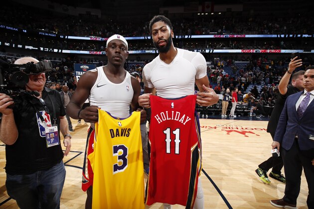 NEW ORLEANS, LA - NOVEMBER 27: Anthony Davis #3 of the Los Angeles Lakers and Jrue Holiday #11 of the New Orleans Pelicans exchange jerseys after a game on November 27, 2019 at Smoothie King Center in New Orleans, Louisiana. NOTE TO USER: User expressly acknowledges and agrees that, by downloading and or using this photograph, User is consenting to the terms and conditions of the Getty Images License Agreement. Mandatory Copyright Notice: Copyright 2019 NBAE (Photo by Jeff Haynes/NBAE via Getty Images)