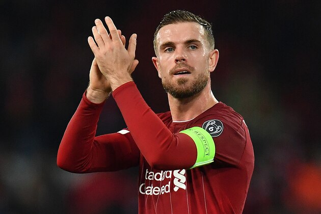 Liverpool's English midfielder Jordan Henderson applauds the fans following the UEFA Champions league Group E football match between Liverpool and Napoli at Anfield in Liverpool, north west England on November 27, 2019. - The match ended in a draw at 1-1. (Photo by Paul ELLIS / AFP) (Photo by PAUL ELLIS/AFP via Getty Images)
