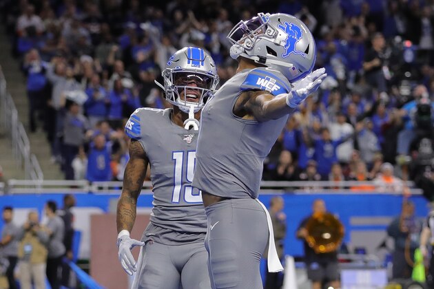 DETROIT, MI - NOVEMBER 28: Marvin Jones #11 of the Detroit Lions celebrates a first quarter touchdown with teammate Kenny Golladay #19 during the first quarter of the game against the Chicago Bears at Ford Field on November 28, 2019 in Detroit, Michigan. (Photo by Leon Halip/Getty Images)