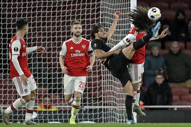 Arsenal's Matteo Guendouzi and Frankfurt's Goncalo Paciencia, from right, challenge for the ball during the Europa League Group F soccer match between Arsenal and Eintracht Frankfurt at the Emirates Stadium, in London, Thursday, Nov. 28, 2019. (AP Photo/Matt Dunham)