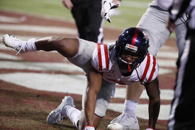 Mississippi wide receiver Elijah Moore (8) reacts following a touchdown by his team against Mississippi State during the second half of an NCAA college football game in Starkville, Miss., Thursday, Nov. 28, 2019. The act resulted in a 15-yard penalty assessed on the extra point that was missed. (AP Photo/Rogelio V. Solis)