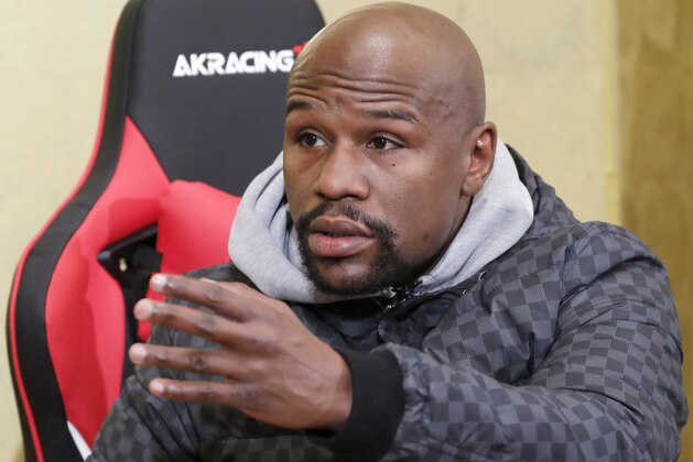 Floyd Mayweather Jr. gestures during a news conference in Tokyo Saturday, Dec. 29, 2018.  Mayweather is scheduled to fight Japanese kickboxer Tenshin Nasukawa in a three-round exhibition match in Japan on New Year's Eve. (AP Photo/Eugene Hoshiko)