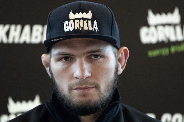 UFC lightweight champion Khabib Nurmagomedov attends a media conference in Moscow, Russia, Monday, Nov. 26, 2018. The Russian professional mixed martial arts fighter Nurmagomedov, said he can imagine a reconciliation with Conor McGregor after the bitter feud around last month's title fight, but said he would like to fight Floyd Mayweather Jr. (AP Photo/Pavel Golovkin)
