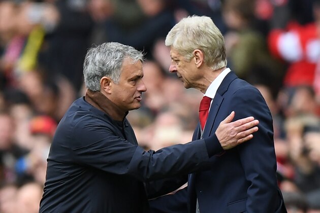 Manchester United's Portuguese manager Jose Mourinho (L) consoles Arsenal's French manager Arsene Wenger after the English Premier League football match between Manchester United and Arsenal at Old Trafford in Manchester, north west England, on April 29, 2018. - Manchester United won the game 2-1. (Photo by Paul ELLIS / AFP) / RESTRICTED TO EDITORIAL USE. No use with unauthorized audio, video, data, fixture lists, club/league logos or 'live' services. Online in-match use limited to 75 images, no video emulation. No use in betting, games or single club/league/player publications. /         (Photo credit should read PAUL ELLIS/AFP via Getty Images)