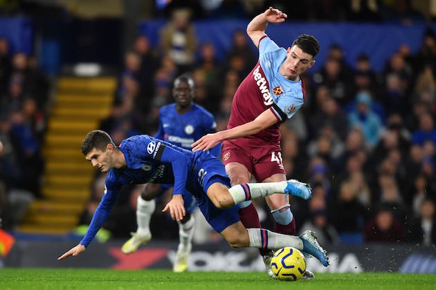 Chelsea's US midfielder Christian Pulisic (L) clashes with West Ham United's English midfielder Declan Rice during the English Premier League football match between Chelsea and West Ham United at Stamford Bridge in London on November 30, 2019. (Photo by Ben STANSALL / AFP) / RESTRICTED TO EDITORIAL USE. No use with unauthorized audio, video, data, fixture lists, club/league logos or 'live' services. Online in-match use limited to 120 images. An additional 40 images may be used in extra time. No video emulation. Social media in-match use limited to 120 images. An additional 40 images may be used in extra time. No use in betting publications, games or single club/league/player publications. /  (Photo by BEN STANSALL/AFP via Getty Images)