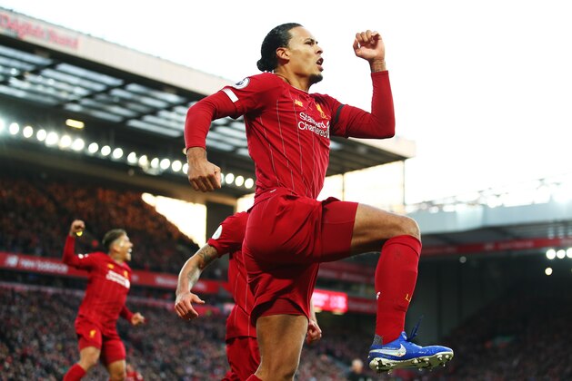 LIVERPOOL, ENGLAND - NOVEMBER 30:  Virgil van Dijk of Liverpool celebrates after scoring his teams first goal during the Premier League match between Liverpool FC and Brighton & Hove Albion at Anfield on November 30, 2019 in Liverpool, United Kingdom. (Photo by Clive Brunskill/Getty Images)