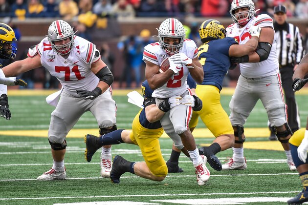 ANN ARBOR, MICHIGAN - NOVEMBER 30: Running Back J.K. Dobbins #2 of the Ohio State Buckeyes runs during the first half of a college football game against the Michigan Wolverines at Michigan Stadium on November 30, 2019 in Ann Arbor, MI. (Photo by Aaron J. Thornton/Getty Images)