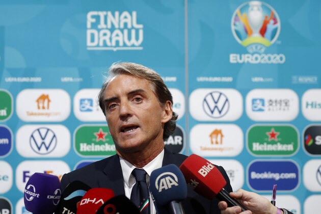 Italy coach Roberto Mancini talks to journalists after the draw for the UEFA Euro 2020 soccer tournament finals in Bucharest, Romania, Saturday, Nov. 30, 2019. (AP Photo/Petr David Josek)