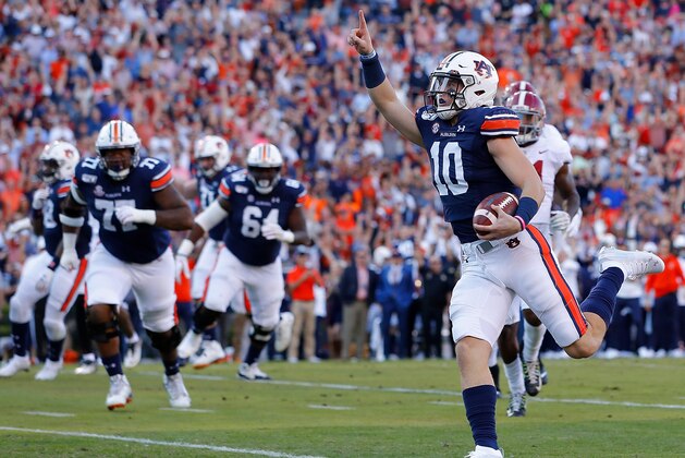 AUBURN, ALABAMA - NOVEMBER 30:  Bo Nix #10 of the Auburn Tigers reacts as he rushes for a touchdown against the Alabama Crimson Tide in the first half at Jordan Hare Stadium on November 30, 2019 in Auburn, Alabama. (Photo by Kevin C. Cox/Getty Images)