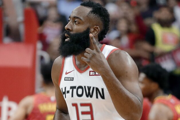 Houston Rockets guard James Harden (13) reacts after scoring a 3-point shot against the Atlanta Hawks during the first half of an NBA basketball game, Saturday, Nov. 30, 2019, in Houston. (AP Photo/Michael Wyke)