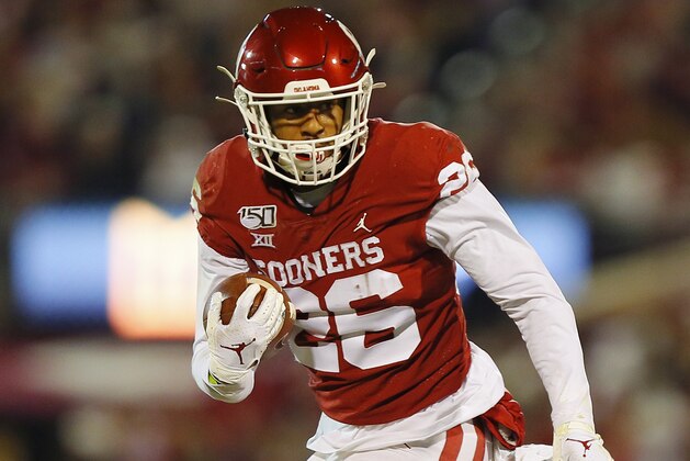 NORMAN, OK - NOVEMBER 23:  Running back Kennedy Brooks #26 of the Oklahoma Sooners picks up a first down against the TCU Horned Frogs on a touchdown drive to start the second quarter on November 23, 2019 at Gaylord Family Oklahoma Memorial Stadium in Norman, Oklahoma.  OU held on to win 28-24.  (Photo by Brian Bahr/Getty Images)
