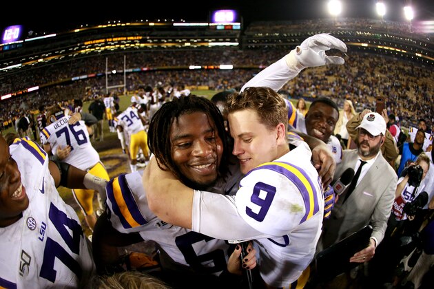 BATON ROUGE, LOUISIANA - NOVEMBER 30: Joe Burrow #9 of the LSU Tigers celebrates with Damien Lewis #68 of the LSU Tigers after his team defeated the Texas A&M Aggies at Tiger Stadium on November 30, 2019 in Baton Rouge, Louisiana. (Photo by Sean Gardner/Getty Images)