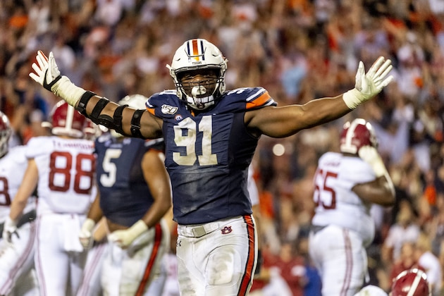 Auburn defensive lineman Nick Coe (91) celebrates after Alabama missed a field goal that would have tied the game in a 48-45 win over Alabama during the second half of an NCAA college football game, Saturday, Nov. 30, 2019, in Auburn, Ala. (AP Photo/Vasha Hunt)