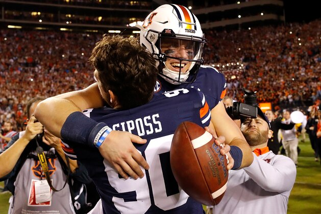 AUBURN, ALABAMA - NOVEMBER 30: Bo Nix #10 of the Auburn Tigers reacts after their 48-45 win over the Alabama Crimson Tide with Arryn Siposs #90 at Jordan Hare Stadium on November 30, 2019 in Auburn, Alabama. (Photo by Kevin C. Cox/Getty Images) AUBURN, ALABAMA - NOVEMBER 30: Bo Nix #10 of the Auburn Tigers reacts after their 48-45 win over the Alabama Crimson Tide with Arryn Siposs #90 at Jordan Hare Stadium on November 30, 2019 in Auburn, Alabama. (Photo by Kevin C. Cox/Getty Images)