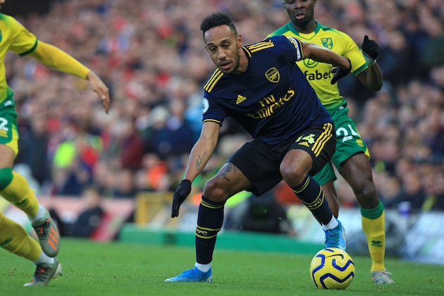 Arsenal's Gabonese striker Pierre-Emerick Aubameyang controls the ball during the English Premier League football match between Norwich City and Arsenal at Carrow Road in Norwich, eastern England on December 1, 2019. (Photo by Lindsey Parnaby / AFP) / RESTRICTED TO EDITORIAL USE. No use with unauthorized audio, video, data, fixture lists, club/league logos or 'live' services. Online in-match use limited to 120 images. An additional 40 images may be used in extra time. No video emulation. Social media in-match use limited to 120 images. An additional 40 images may be used in extra time. No use in betting publications, games or single club/league/player publications. /  (Photo by LINDSEY PARNABY/AFP via Getty Images)