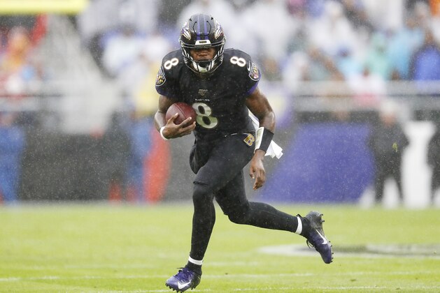 BALTIMORE, MARYLAND - DECEMBER 01: Lamar Jackson #8 of the Baltimore Ravens runs with the ball during the first half against the San Francisco 49ers at M&T Bank Stadium on December 01, 2019 in Baltimore, Maryland. (Photo by Scott Taetsch/Getty Images)