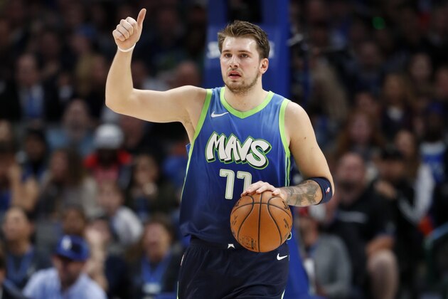 Dallas Mavericks' Luka Doncic signals to the offense during an NBA basketball game against the Los Angeles Clippers in Dallas, Tuesday, Nov. 26, 2019. (AP Photo/Tony Gutierrez)