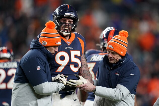 Denver Broncos defensive end Derek Wolfe is helped off the field after getting hunt during the second half of an NFL football game against the Los Angeles Chargers Sunday, Dec. 1, 2019, in Denver. (AP Photo/Jack Dempsey) Denver Broncos defensive end Derek Wolfe is helped off the field after getting hunt during the second half of an NFL football game against the Los Angeles Chargers Sunday, Dec. 1, 2019, in Denver. (AP Photo/Jack Dempsey)