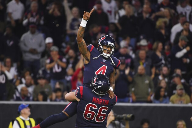 Houston Texans quarterback Deshaun Watson (4) is lifted by center Nick Martin (66) as they celebrate a touchdown against the New England Patriots during the first half of an NFL football game Sunday, Dec. 1, 2019, in Houston. (AP Photo/Eric Christian Smith)