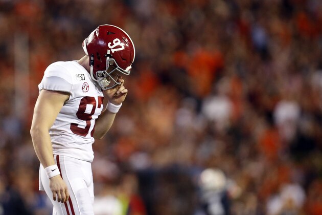 Alabama place kicker Joseph Bulovas (97) walks off the field after missing a field goal that would've tied the game late in the second half of an NCAA college football game against Auburn, Saturday, Nov. 30, 2019, in Auburn, Ala. Auburn won 48-45. (AP Photo/Butch Dill)