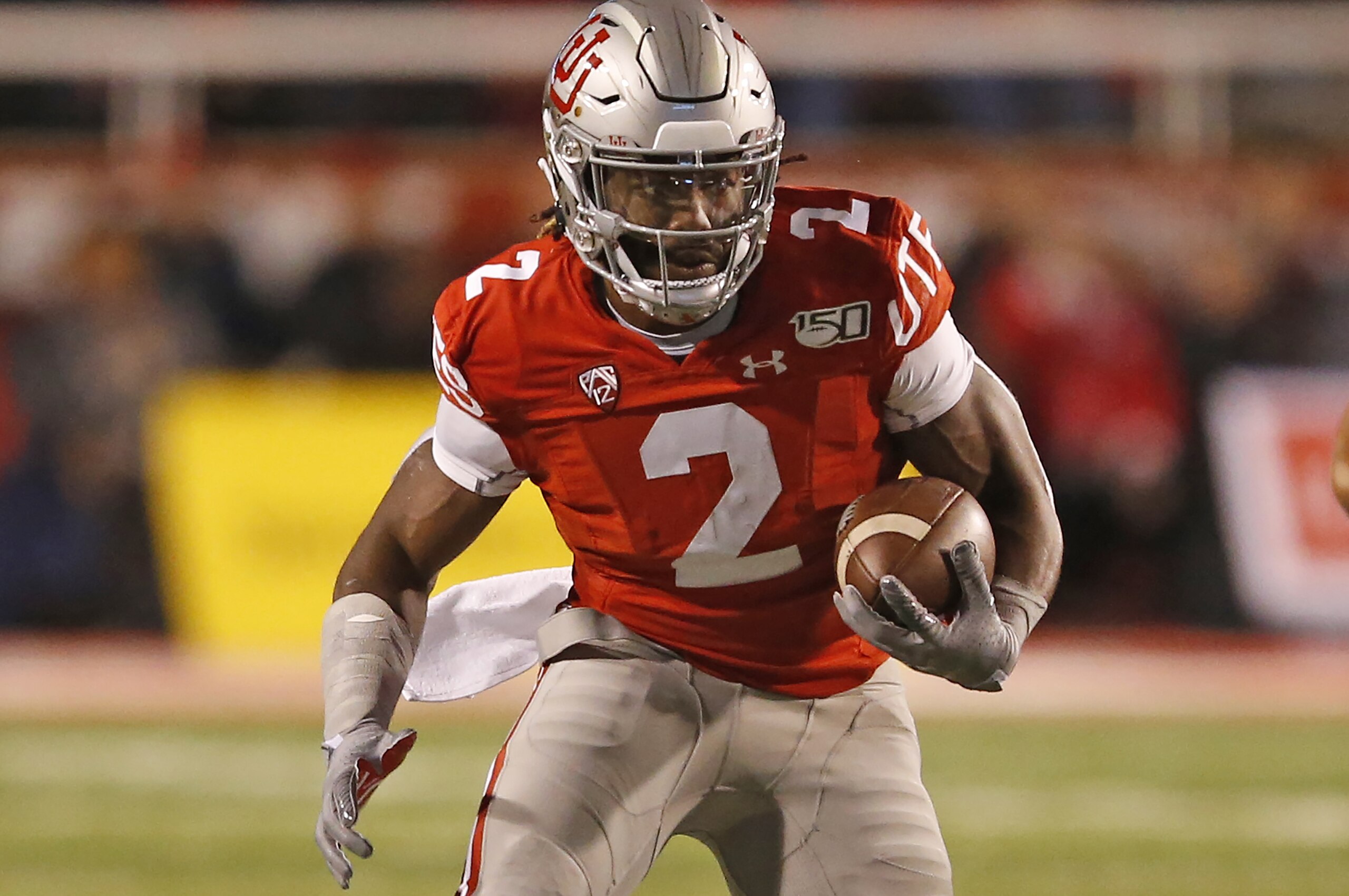 Utah running back Zack Moss (2) carriers the ball against UCLA in the first half during an NCAA college football game Saturday, Nov. 16, 2019, in Salt Lake City. (AP Photo/Rick Bowmer)