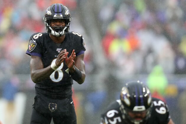 BALTIMORE, MARYLAND - DECEMBER 01: Quarterback Lamar Jackson #8 of the Baltimore Ravens takes a snap against the San Francisco 49ers defense at M&T Bank Stadium on December 01, 2019 in Baltimore, Maryland. (Photo by Rob Carr/Getty Images)