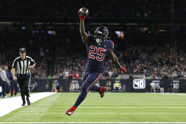 HOUSTON, TEXAS - DECEMBER 01: Duke Johnson #25 of the Houston Texans scores a 14 yard touchdown against the New England Patriots during the first quarter in the game at NRG Stadium on December 01, 2019 in Houston, Texas. (Photo by Tim Warner/Getty Images)
