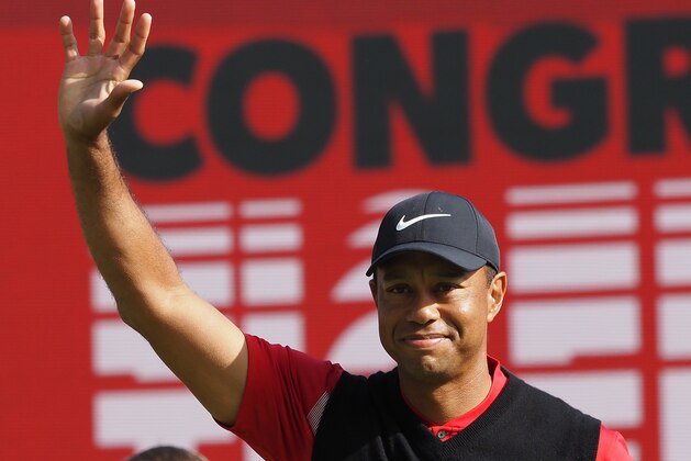 Tiger Woods of the US waves on the 18th hole green after finishing the final round of the PGA ZOZO Championship golf tournament at the Narashino Country Club in Inzai, Chiba prefecture on October 28, 2019. (Photo by TOSHIFUMI KITAMURA / AFP) (Photo by TOSHIFUMI KITAMURA/AFP via Getty Images)