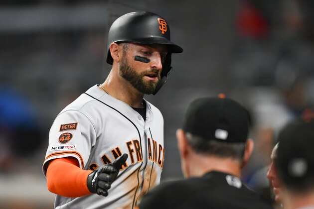 San Francisco Giants' Kevin Pillar enters the dugout after scoring against the Atlanta Braves during the seventh inning of a baseball game Saturday, Sept. 21, 2019, in Atlanta.(AP Photo/John Amis)